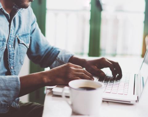 A man working from home on a laptop.